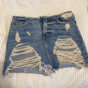 Low rise ripped denim mini skirt